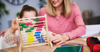 Mother and daughter having abacus kit
