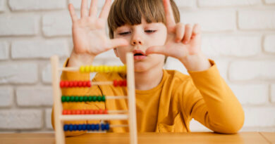 Kid practicing abacus math